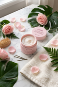 Flat lay of ENTEE 3-in-1 Curly Hair Treatment jar with rose petals on marble